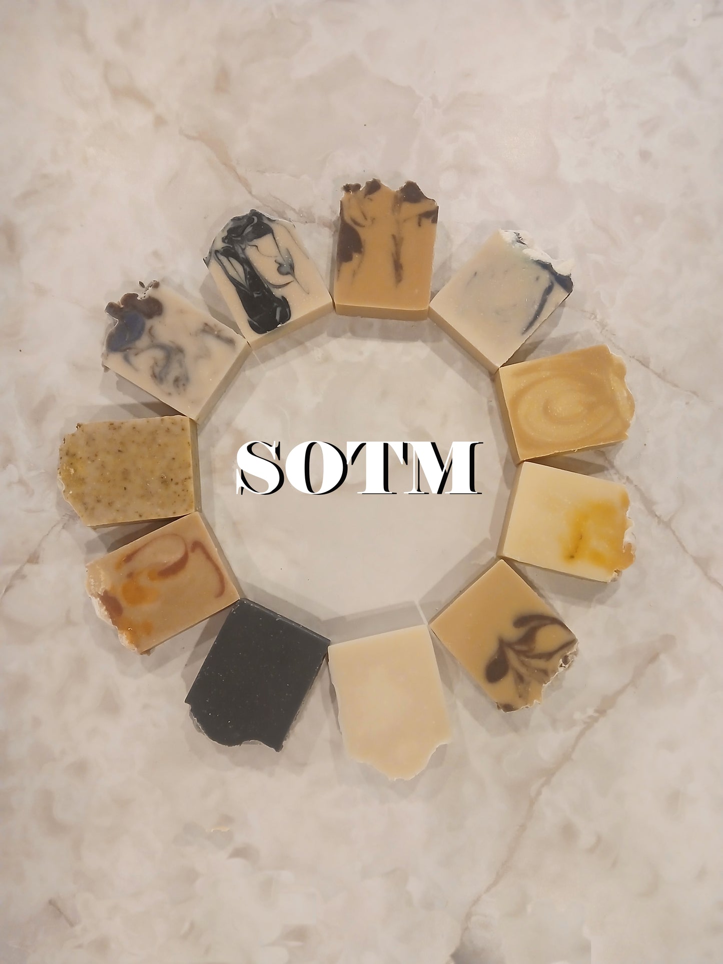 a circle of soap bars with the acronym SOTM in the middle which stands for Soap of the Month