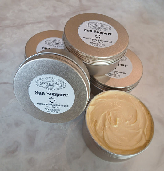 Gold tin with creamy sun lotion inside